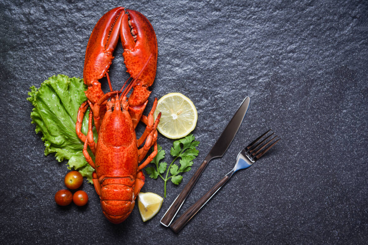 vecteezy_lobster-shrimp-seafood-with-lemon-herbs-and-spices-on-dark_7139589_784-2500x1669.jpg
