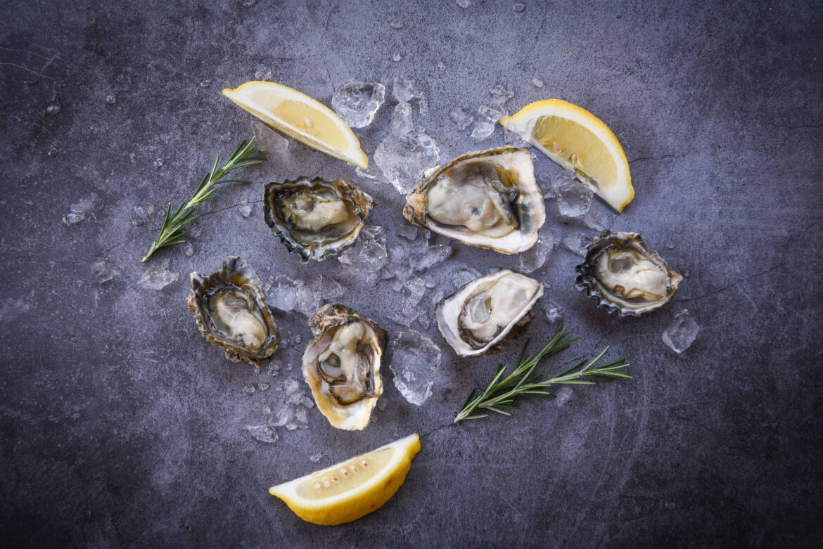 vecteezy_open-oyster-shell-with-herb-spices-lemon-rosemary-served_8369343_90-2500x1669.jpg